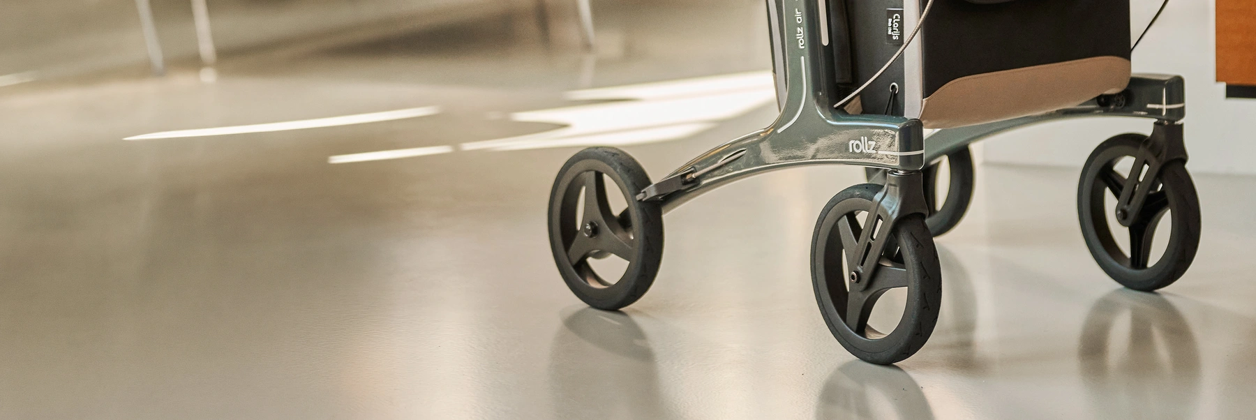 Closeup of a Rollz Air lightweight carbon rollator with premium bags