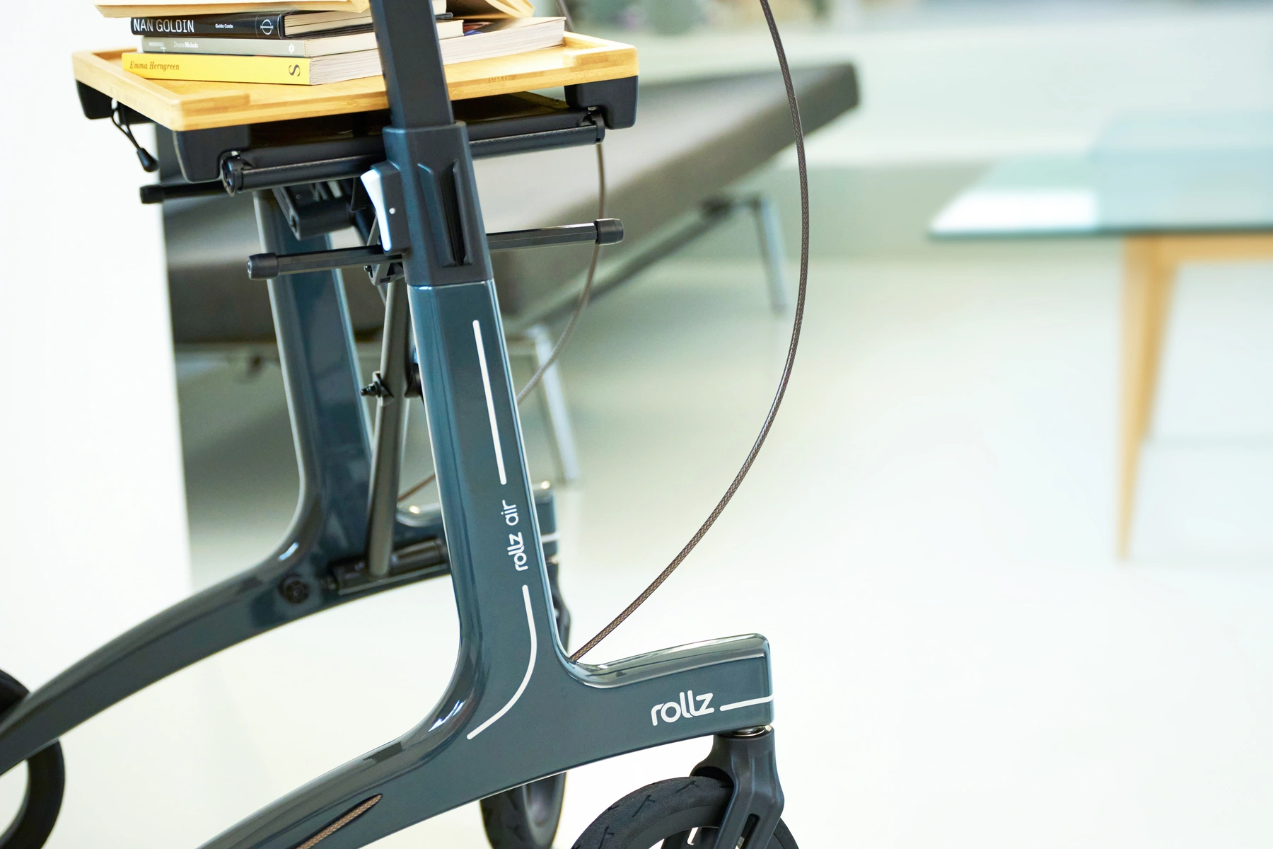 Rollz Air rollator indoors with books on the tray