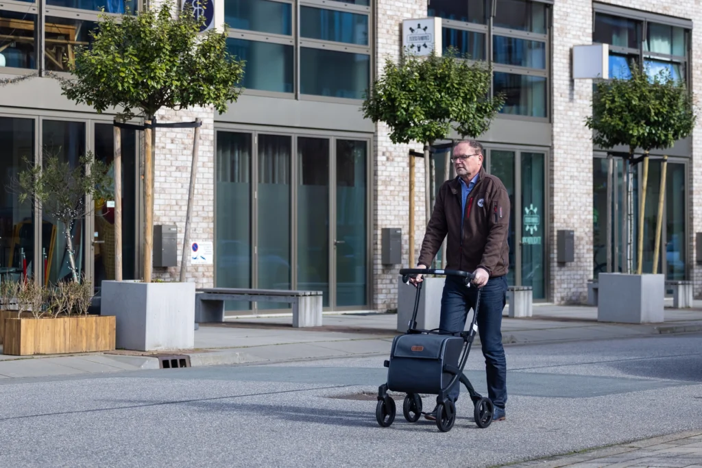 A man walking with his four wheeled Rollz Flex shopping trolley