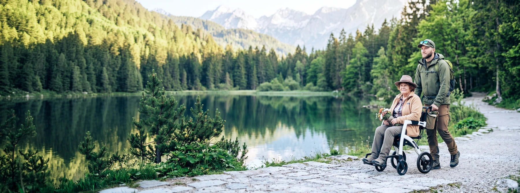 A push attendant hikes trough the nature with his mother in the Rollz Motion wheelchair